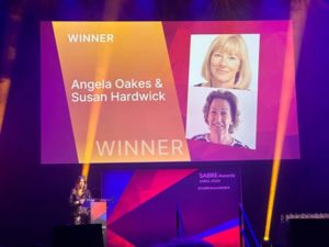 Sue Hardwick and Angela Oakes announced on stage as winners of the PRovoke-Media SABRE individual award